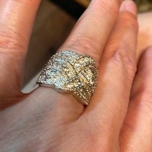 This is 925 sterling silver ring of all clear stones not diamonds.